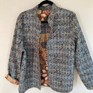 Reversible quilted jacket, with no labels at all.  I suspect it is a silk blend.